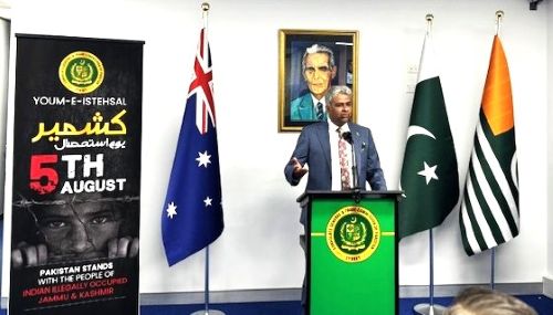 A person standing at a podium with flags

AI-generated content may be incorrect.