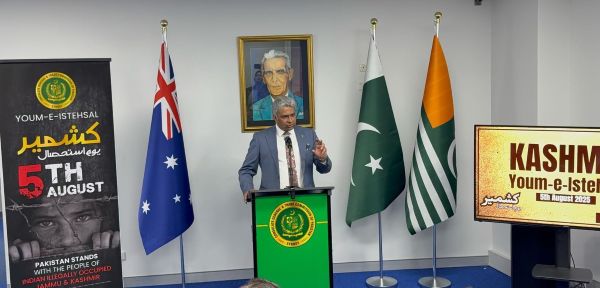 A person standing at a podium with flags behind him

AI-generated content may be incorrect.