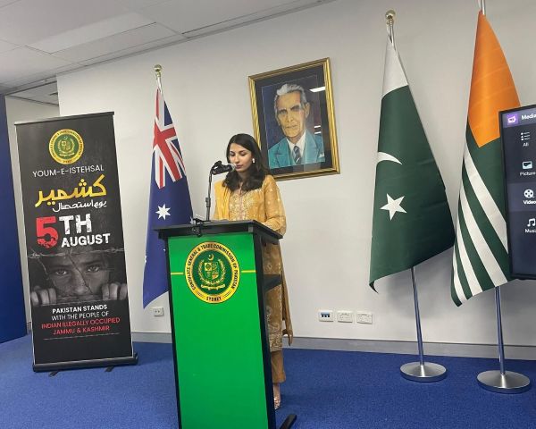 A person standing at a podium with flags

AI-generated content may be incorrect.