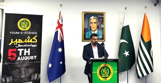 A person standing at a podium with flags

AI-generated content may be incorrect.