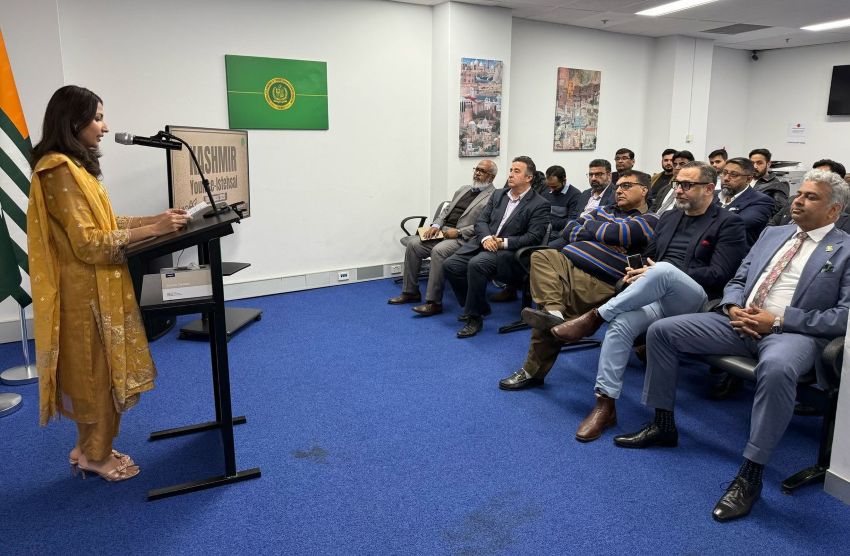 A person standing at a podium with a microphone in front of a group of people

AI-generated content may be incorrect.