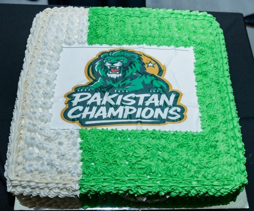 A cake with a green and white frosting

AI-generated content may be incorrect.