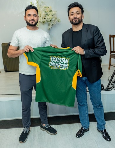 Two men holding a green and yellow shirt

AI-generated content may be incorrect.