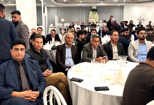 A group of people sitting around a table

AI-generated content may be incorrect.