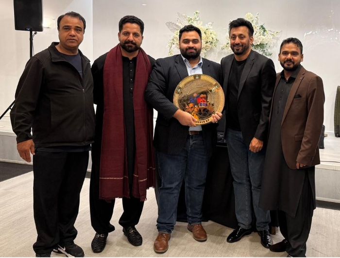 A group of men posing for a photo

AI-generated content may be incorrect.