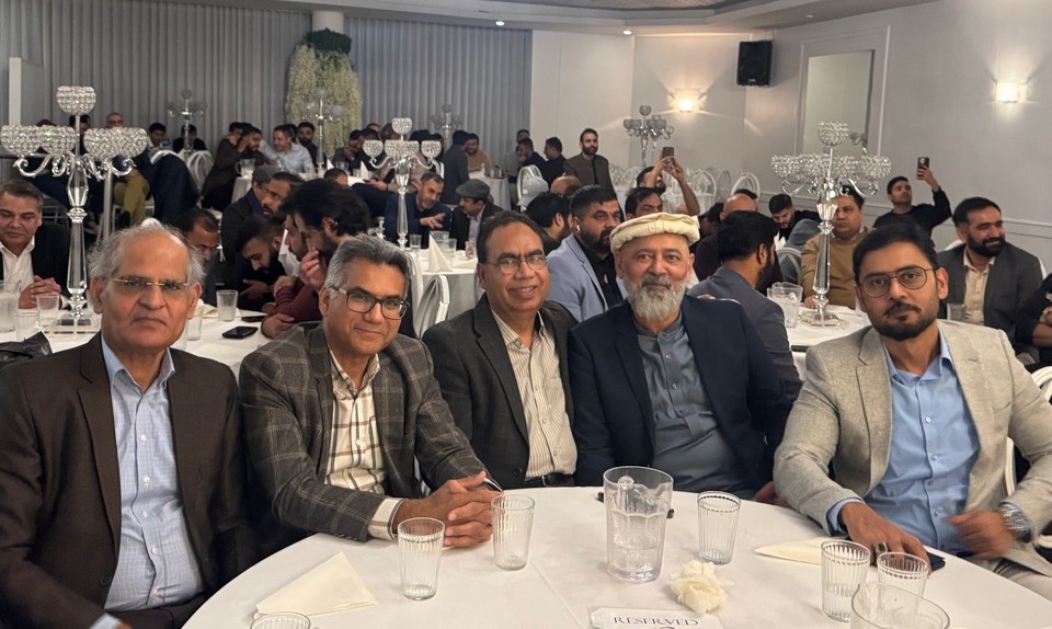 A group of men sitting at a table

AI-generated content may be incorrect.