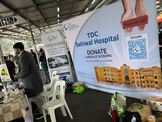 A group of people standing in front of a banner

AI-generated content may be incorrect.