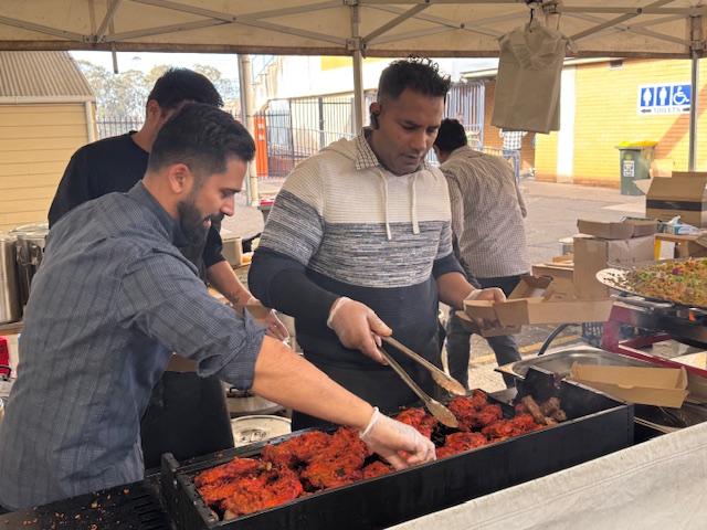 A group of men cooking food

AI-generated content may be incorrect.