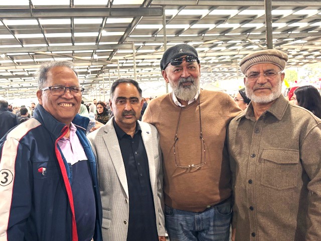 A group of men standing together

AI-generated content may be incorrect.