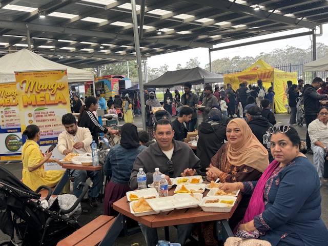 A group of people sitting at a table

AI-generated content may be incorrect.