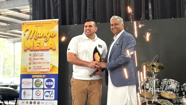 Two men standing on a stage

AI-generated content may be incorrect.