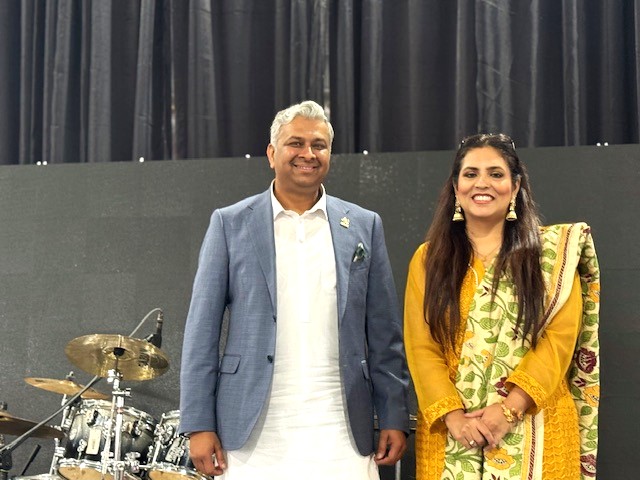 A person and person standing in front of drums

AI-generated content may be incorrect.