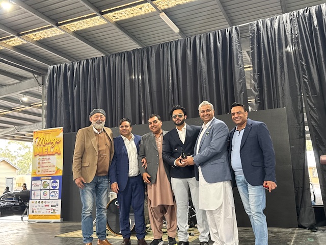 A group of men standing together

AI-generated content may be incorrect.