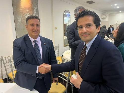 Two men in suits shaking hands

AI-generated content may be incorrect.