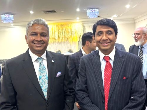 A couple of men in suits

AI-generated content may be incorrect.