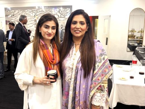 Two women standing together smiling

AI-generated content may be incorrect.