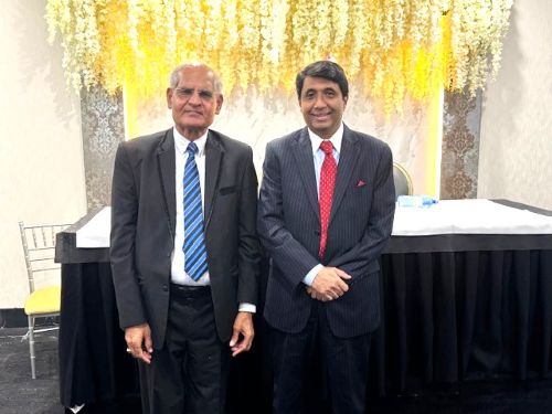 A couple of men in suits

AI-generated content may be incorrect.