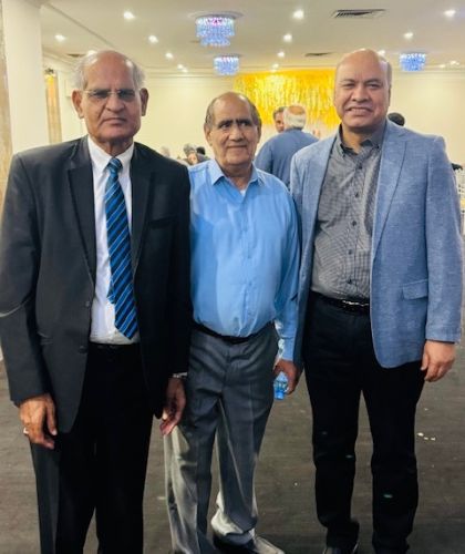 A group of men standing together

AI-generated content may be incorrect.