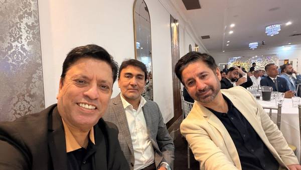 A group of men sitting in a room

AI-generated content may be incorrect.