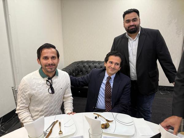 A group of men posing for a picture

AI-generated content may be incorrect.