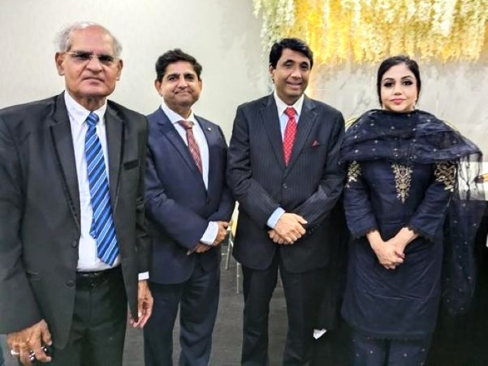 A group of people posing for a photo

AI-generated content may be incorrect.