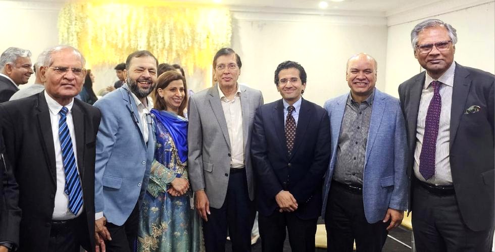 A group of people standing together

AI-generated content may be incorrect.