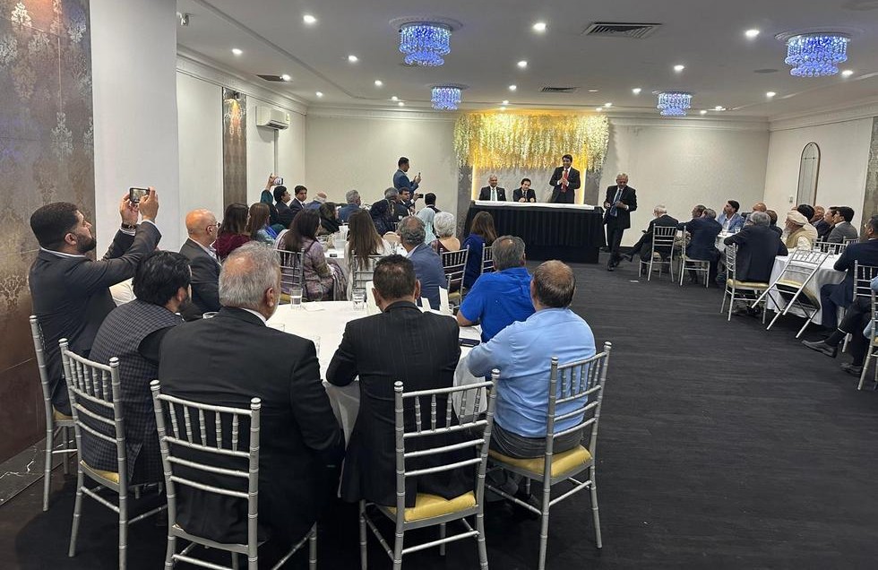 A group of people sitting in chairs in a room

AI-generated content may be incorrect.