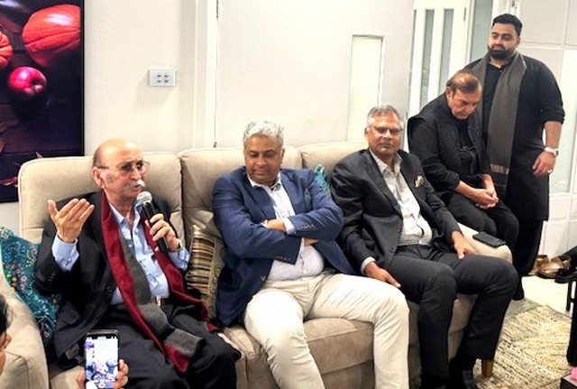 A group of men sitting on a couch

AI-generated content may be incorrect.