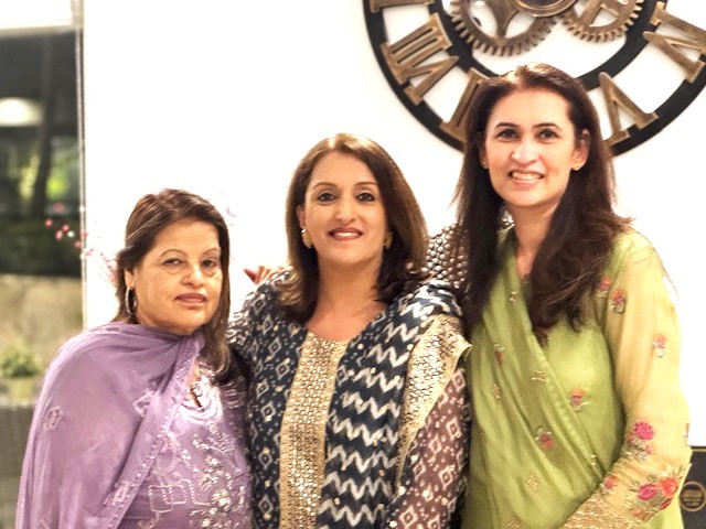 A group of women posing for a photo

AI-generated content may be incorrect.