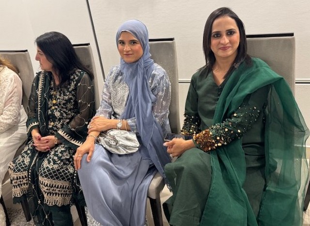 A group of women sitting in chairs

AI-generated content may be incorrect.
