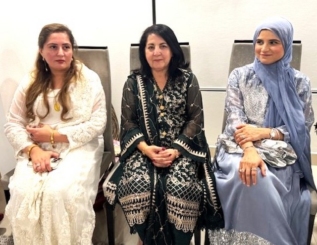 A group of women sitting in chairs

AI-generated content may be incorrect.