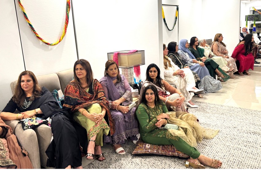 A group of women sitting on the floor

AI-generated content may be incorrect.