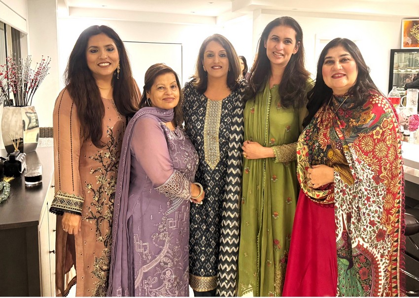 A group of women posing for a photo

AI-generated content may be incorrect.