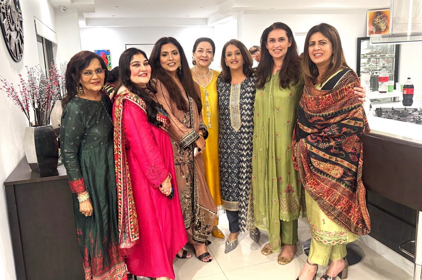 A group of women posing for a photo

AI-generated content may be incorrect.
