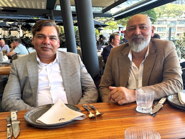 Two men sitting at a table

AI-generated content may be incorrect.