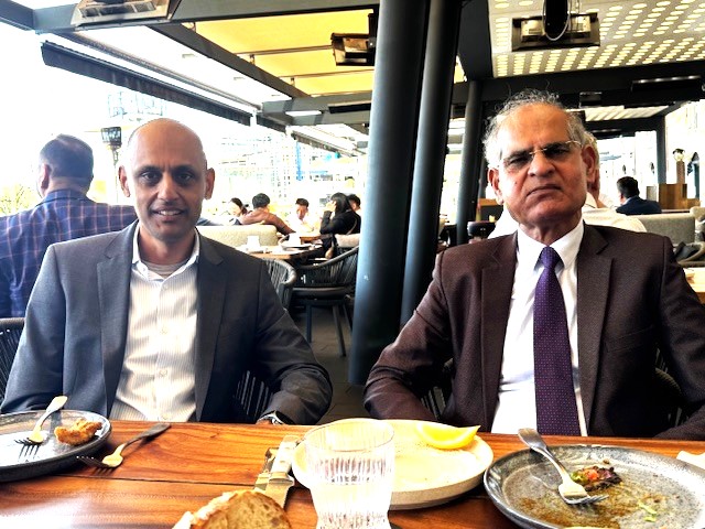 Two men sitting at a table

AI-generated content may be incorrect.