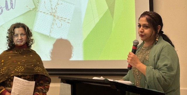 A person speaking into a microphone

AI-generated content may be incorrect.