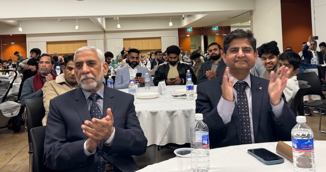 A group of men sitting at tables

AI-generated content may be incorrect.