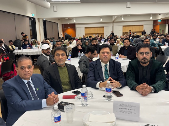 A group of men sitting at a table

AI-generated content may be incorrect.