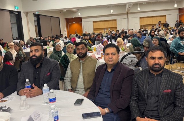 A group of people sitting at a table

AI-generated content may be incorrect.