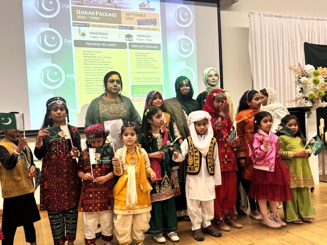 A group of people standing in front of a screen

AI-generated content may be incorrect.