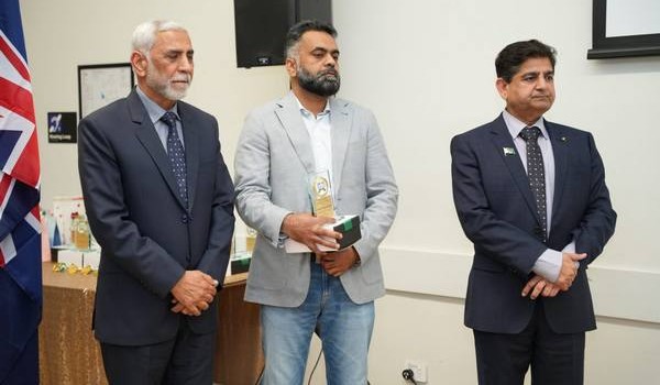 A group of men standing in suits

AI-generated content may be incorrect.