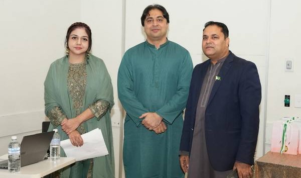 A group of people standing in a room

AI-generated content may be incorrect.