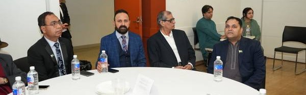 A group of men sitting at a round table

AI-generated content may be incorrect.