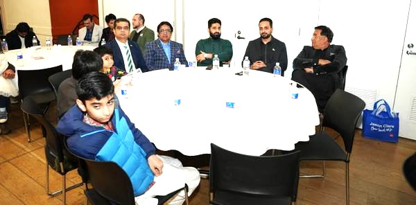 A group of people sitting around a round table

AI-generated content may be incorrect.