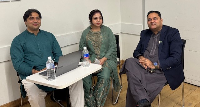 A group of people sitting at a table

AI-generated content may be incorrect.