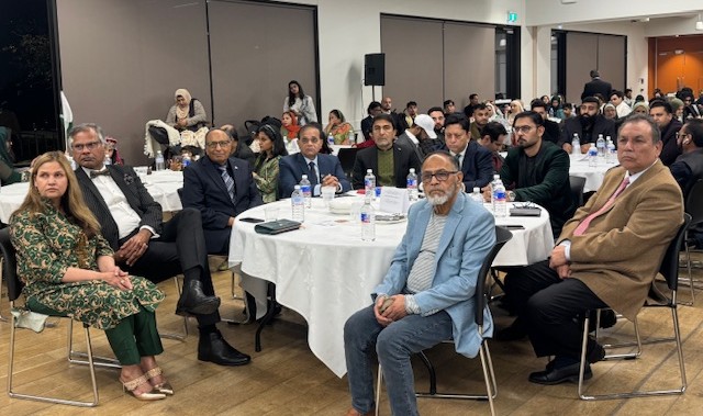 A group of people sitting at a table

AI-generated content may be incorrect.