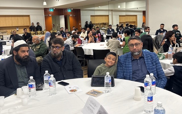 A group of people sitting at a table

AI-generated content may be incorrect.