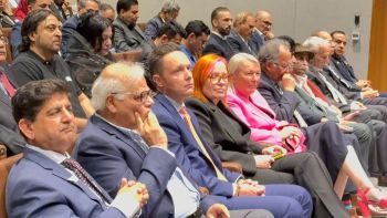 A group of people sitting in a row

AI-generated content may be incorrect.