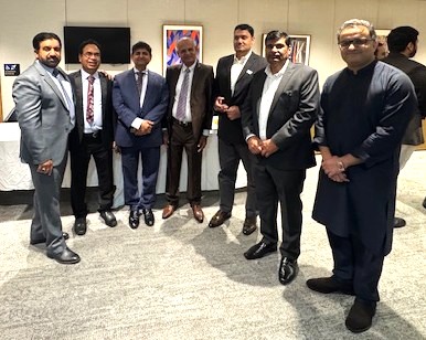 A group of men standing in a room

AI-generated content may be incorrect.